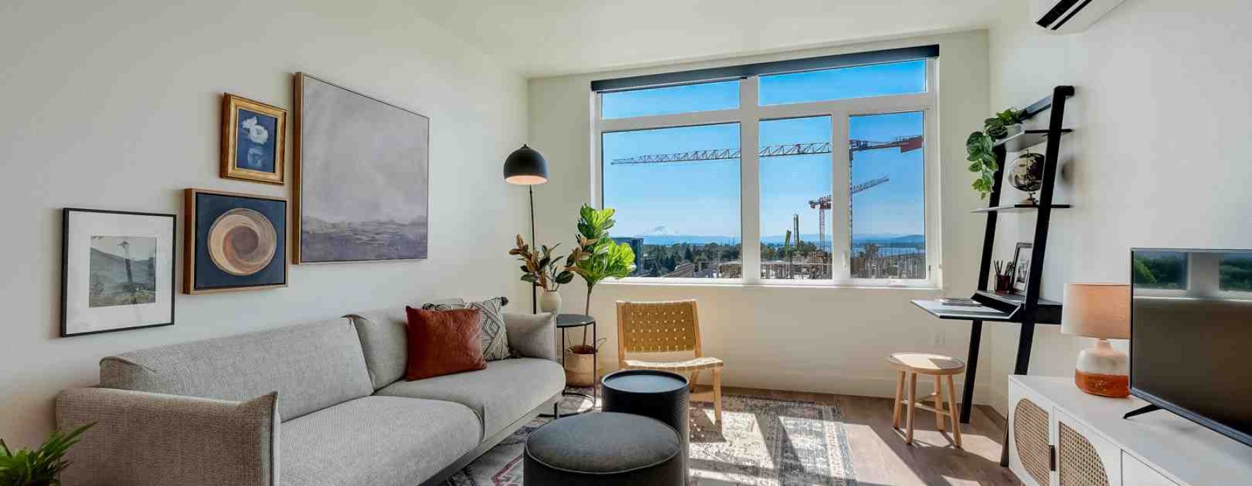 Modern L-shaped apartment living room with natural light
