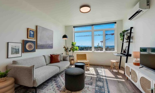 Modern L-shaped apartment living room with natural light