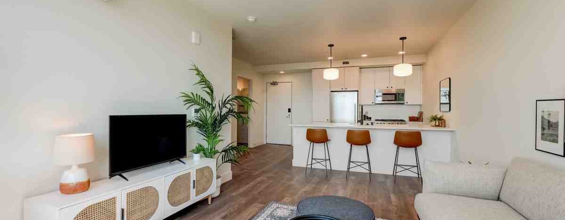 open concept living and dining area in a furnished apartment