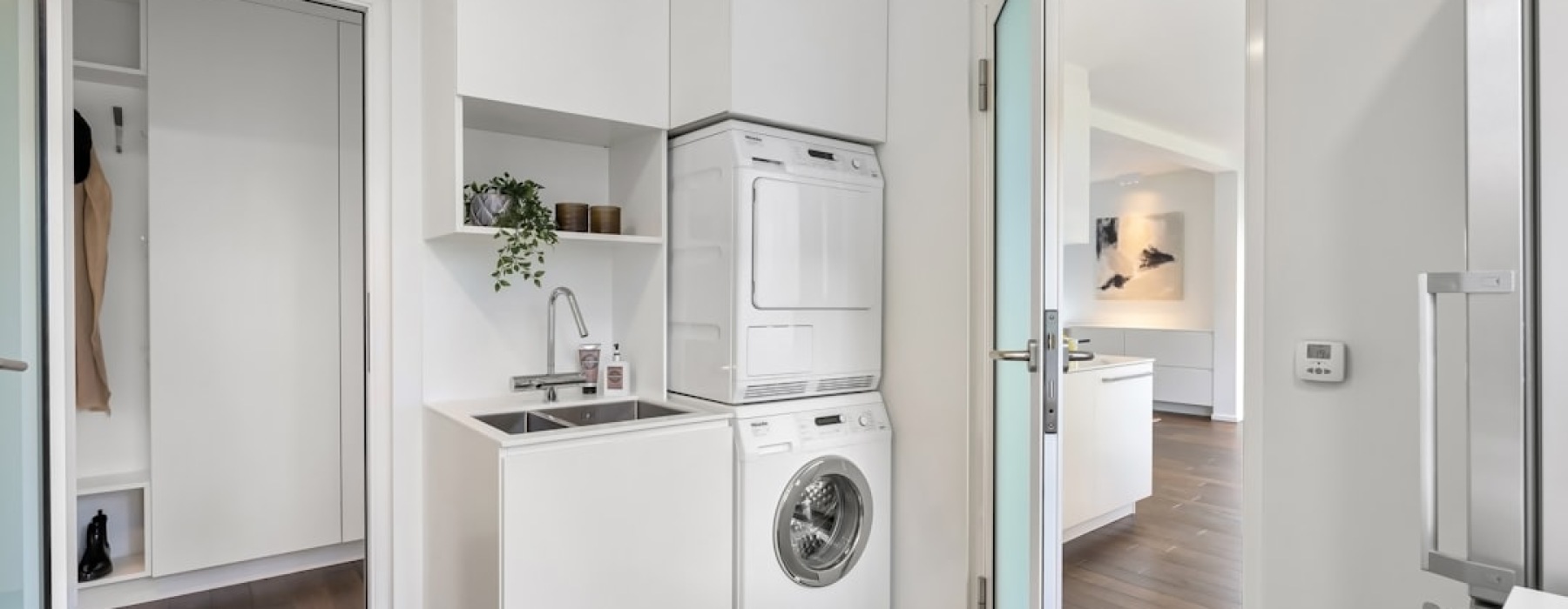 in unit laundry apartment closet with washer and dryer